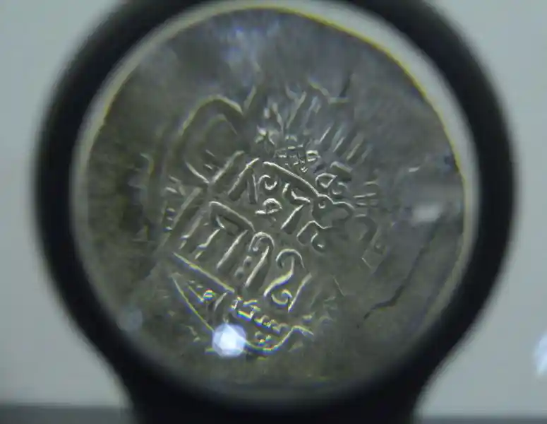 Jesus fish and six-pointed star on a coin